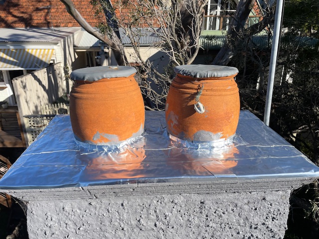 Bees living in chimney-pot
